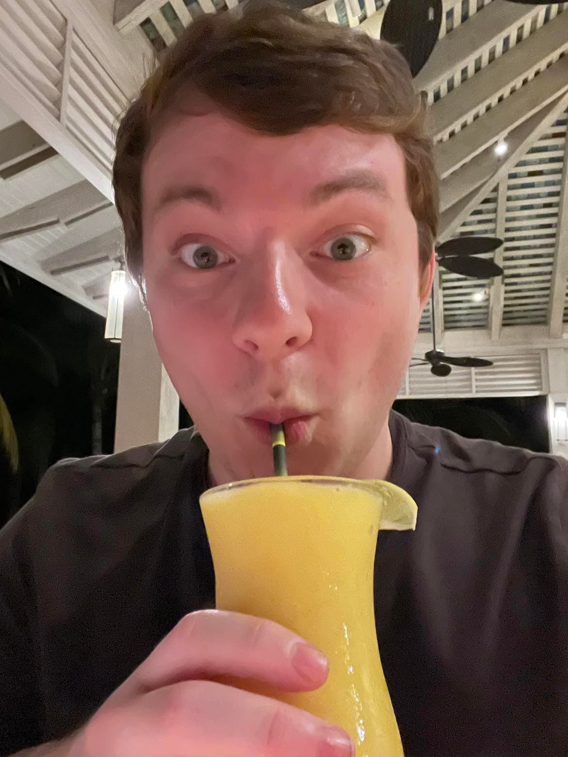 Josh drinking a Mango Daiquiri