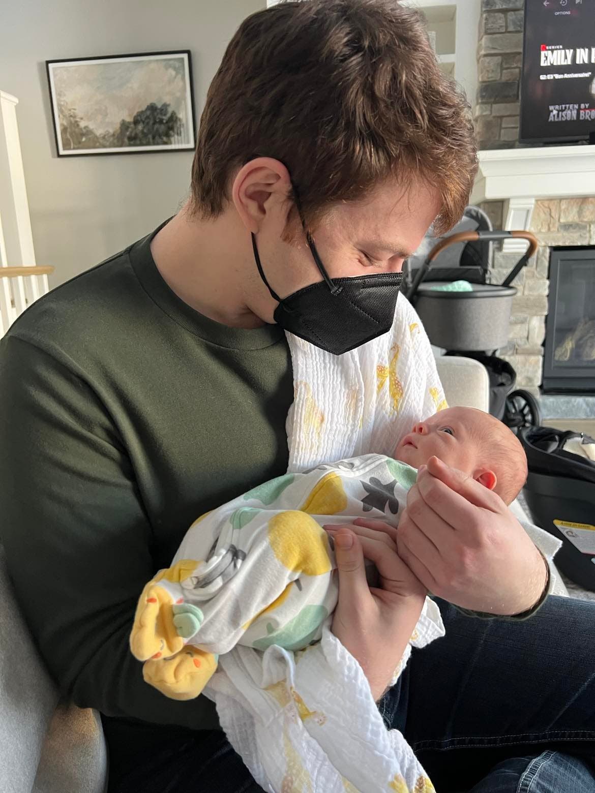 Josh holding newborn Harrison