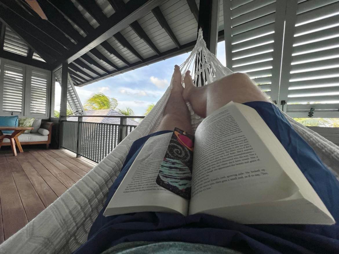 Josh reading on a hammock