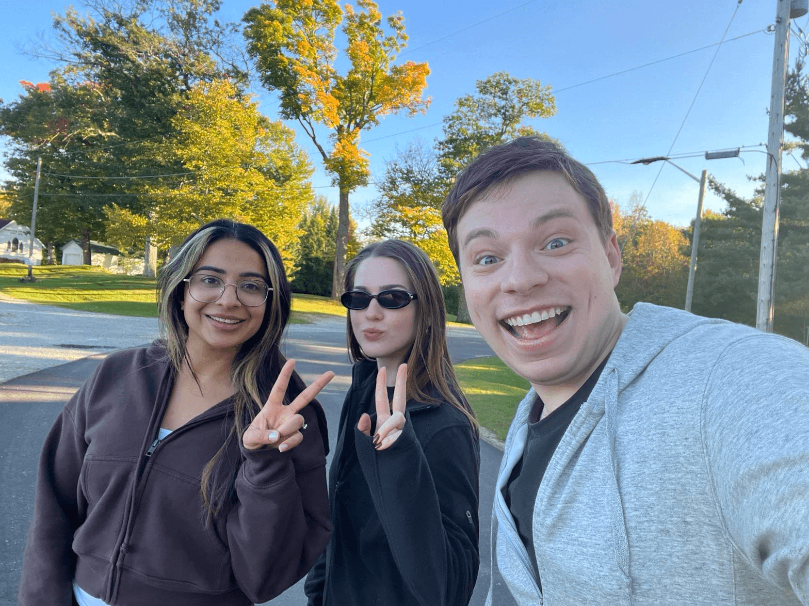 selfie of two girls and a guy