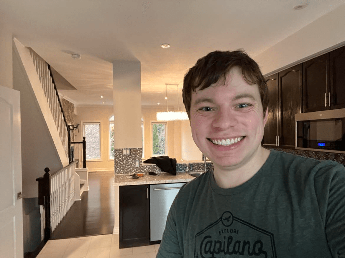 Selfie of someone happy that they just moved into a new home